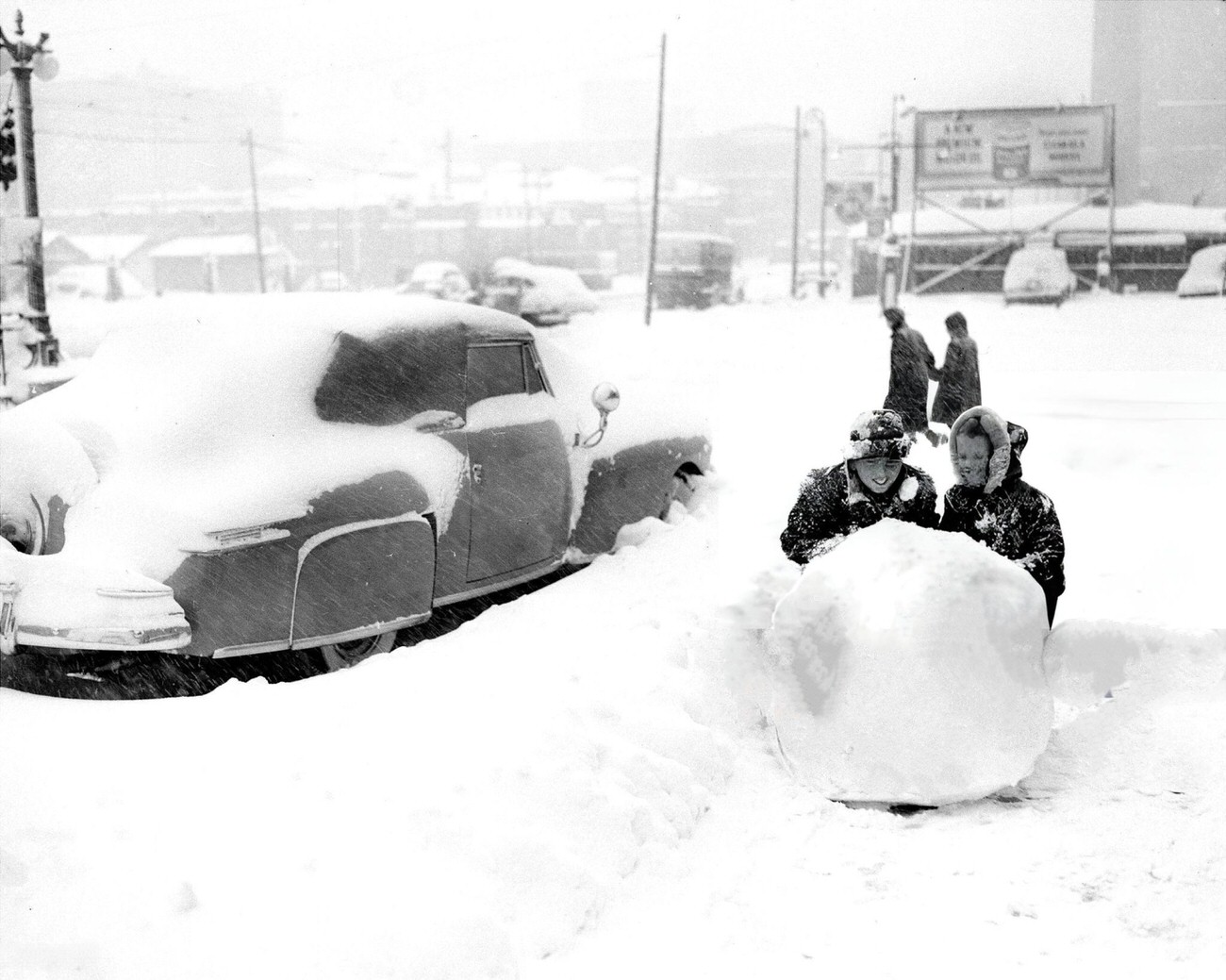 Geoffrey Beck And Barbara Puehl Enjoy A Snowball Fight, Disregarding Stranded Cars In The Bronx, 1940S