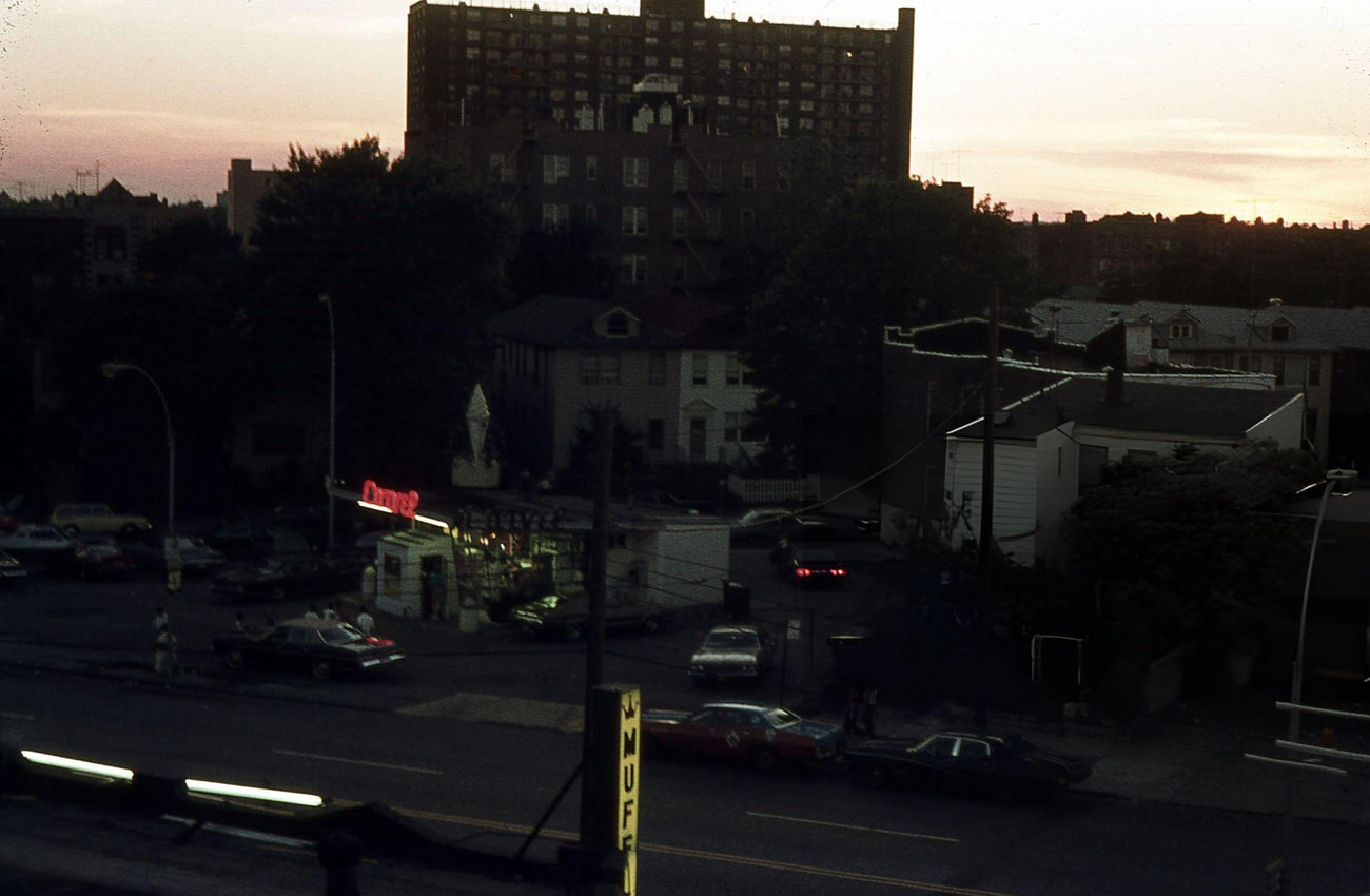 Neon Signs Of A Carvel Ice Cream Parlor Glow At Dusk In The Bronx, 1976.