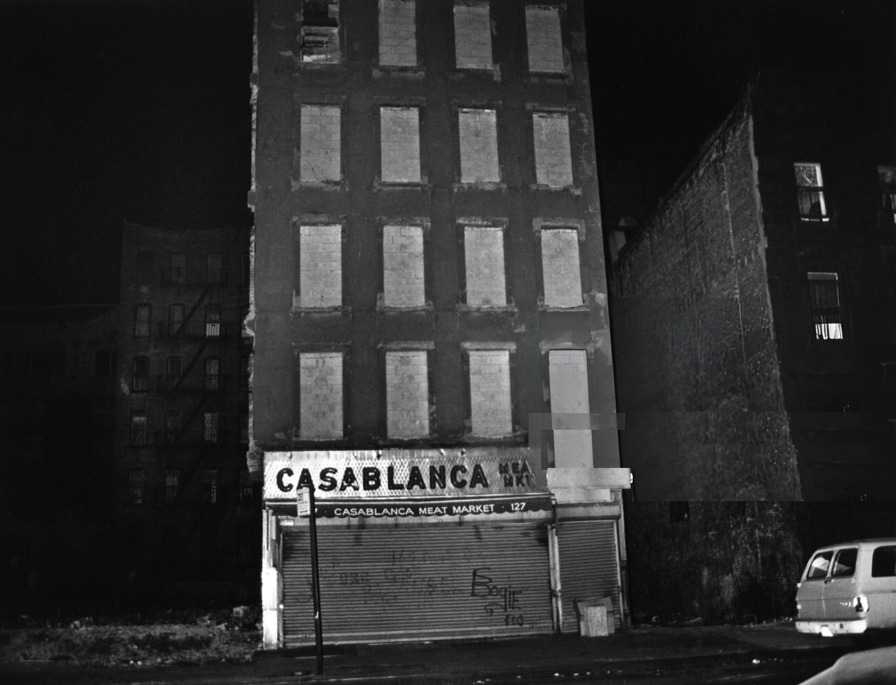 At Night, An Abandoned Building'S Facade In The South Bronx Shows A Former Meat Market, 1977.