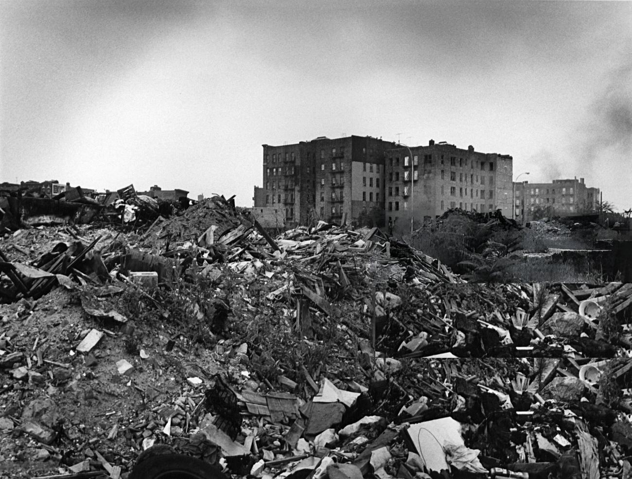 Across Rubble, Abandoned Apartment Buildings In The South Bronx Are Visible, 1977.