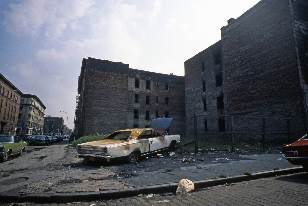 An Abandoned Car In The South Bronx, New York City, Symbolizes Urban Decay In 1977.