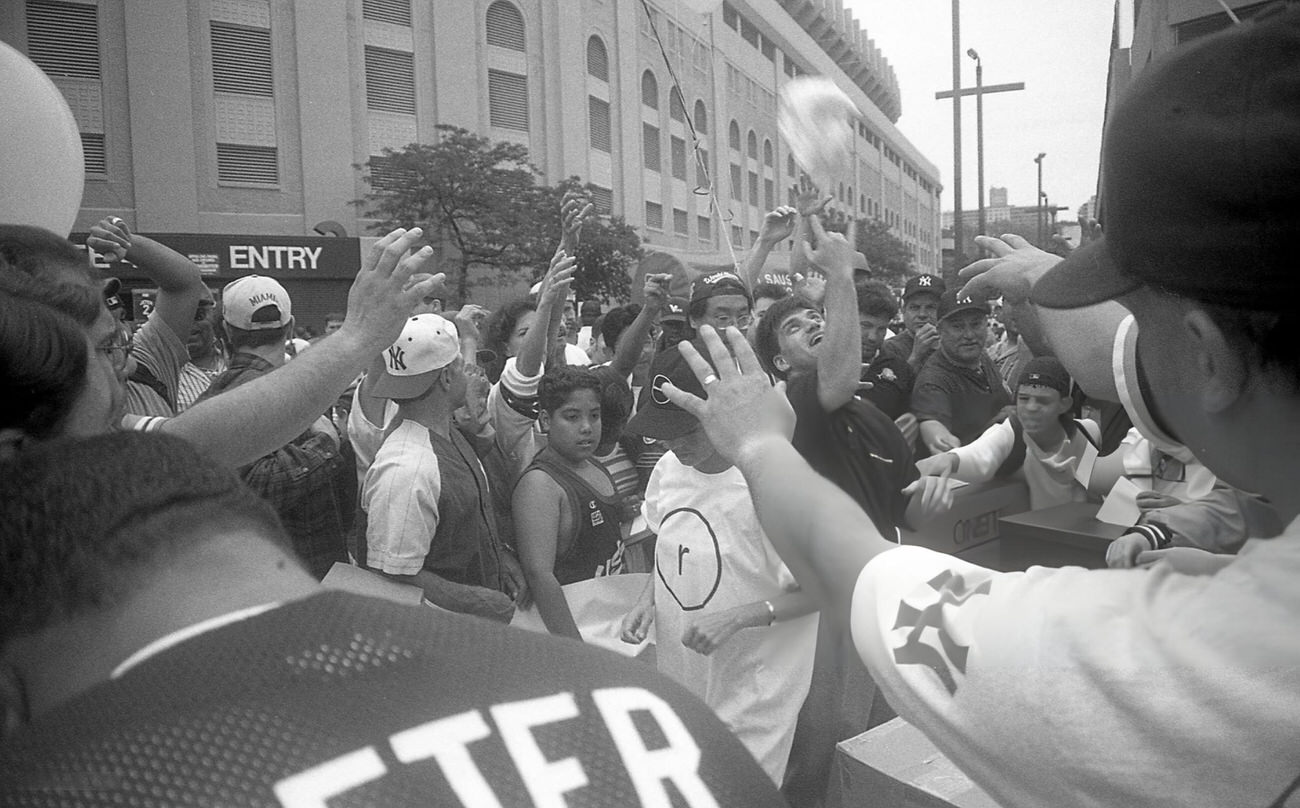A Crowd Outside Yankee Stadium In The Concourse Neighborhood Reaches For Free T-Shirts, Bronx, 1997.