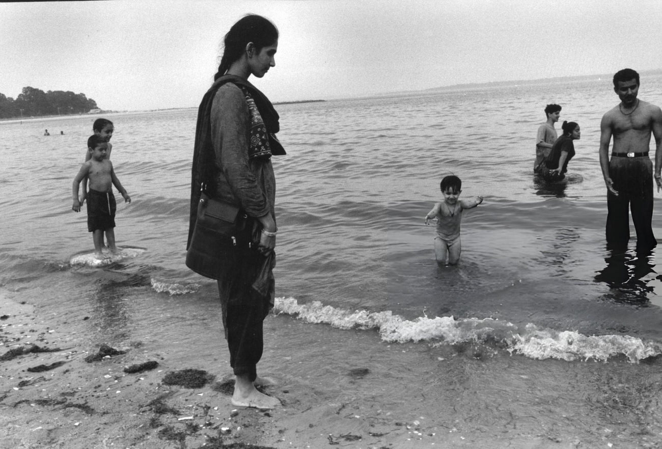 An Immigrant Family Enjoys Orchard Beach In The Summer, Bronx, 1998.