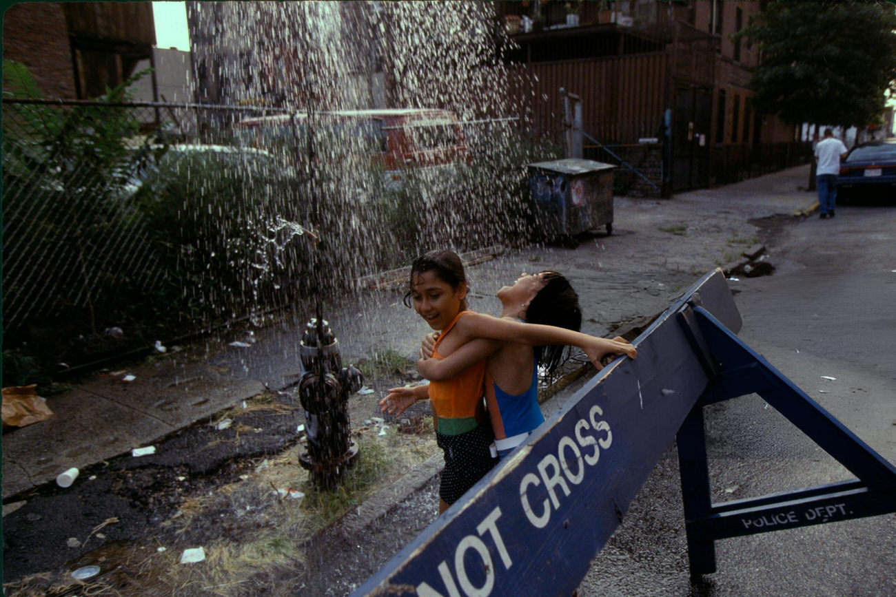 Residents Cool Off With A Fire Hydrant During A Heat Wave, Bronx, 1995.