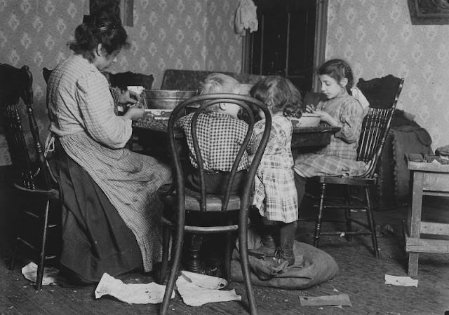 Mrs. Lucy Libertime And Family, Johnnie, 4 Years Old, Mary 6 Years, Millie, 9, Picking Nuts In The Basement Tenement.