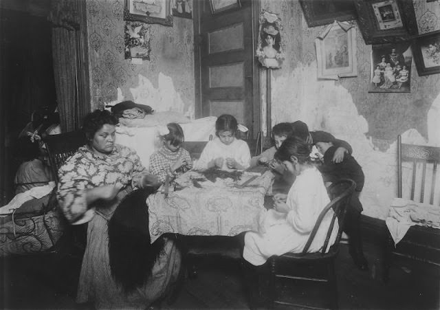 Mrs. Mauro, And Family Working On Feathers, Make $2.25 A Week. In Vacation Two Or Three Times As Much. Victoria, 8, Angeline, A Neighbor, 10, Fiorandi, 10, Maggie, 11.