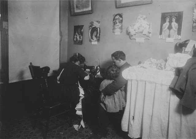 Mrs. Ricca, Making Rompers For Campbell Kids. Husband Out Of Work. New York City, December 1911