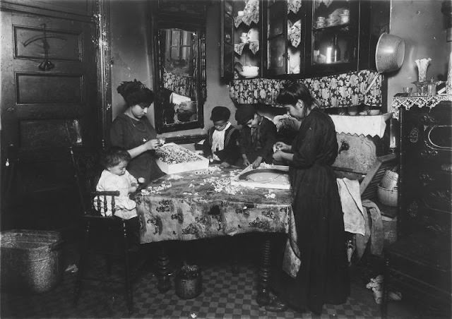 Family Of Mrs. Motto Making Flowers In A Dirty Tenement. Josephine, 13 Years, Helps Outside Of School Hours Until 9 P.m. Sometimes.