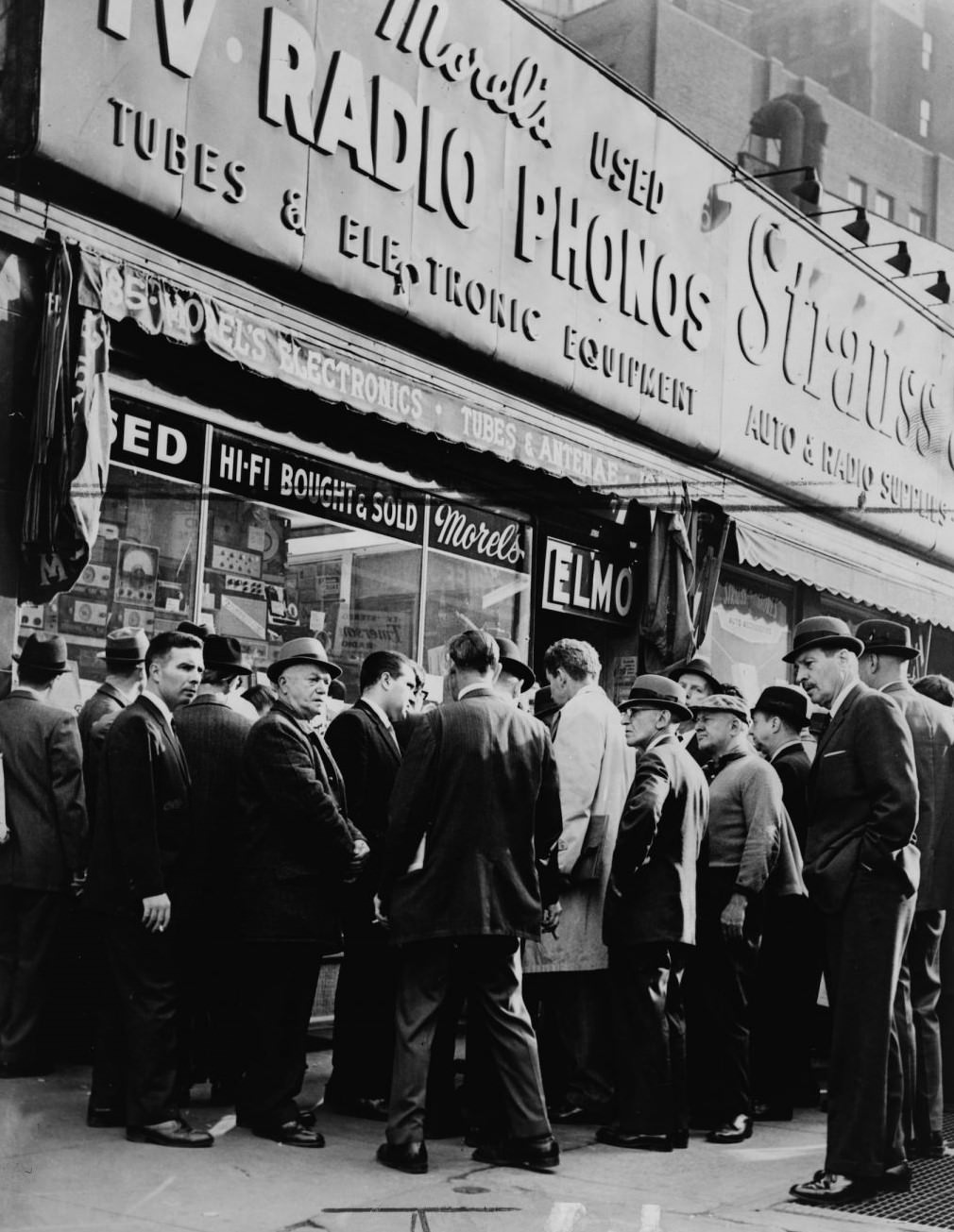 Crowd Listens Outside Radio Shop At Greenwich And Dey Sts. For News On President Kennedy, New York City, 1963.