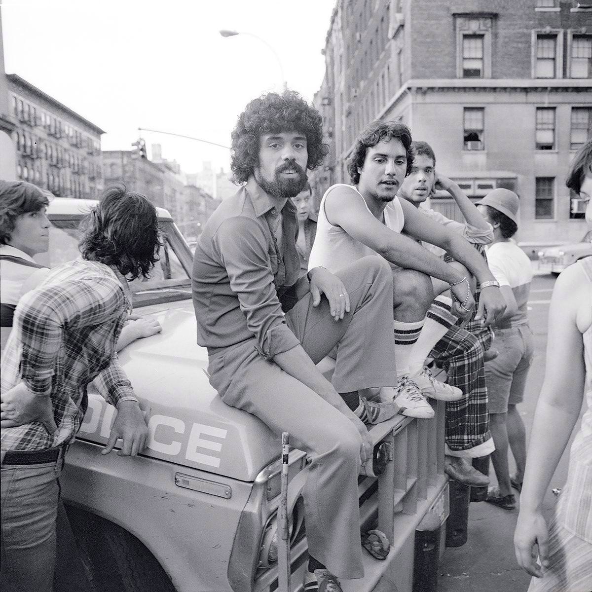 During The New York City Blackout Of 1977, Meryl Meisler Captured This Photo Of A Group Of Guys Hanging Out On The Hood Of A Police Car In New York City On July 13, 1977.