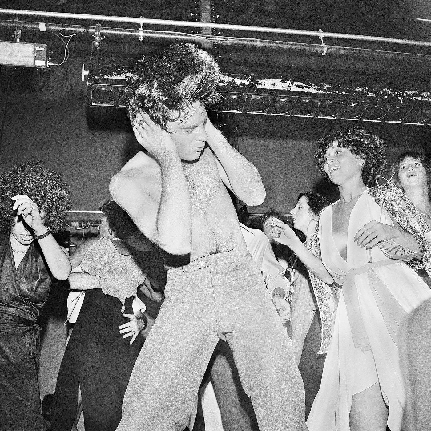 “Holding Head As Hair Flies While Dancing” With Judi Jupiter (Studio 54, New York; July, 1977).