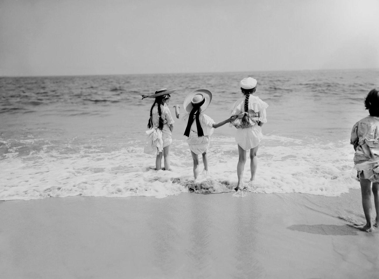 Three Young Girls Wading Into Water At Coney Island, Brooklyn, 1905