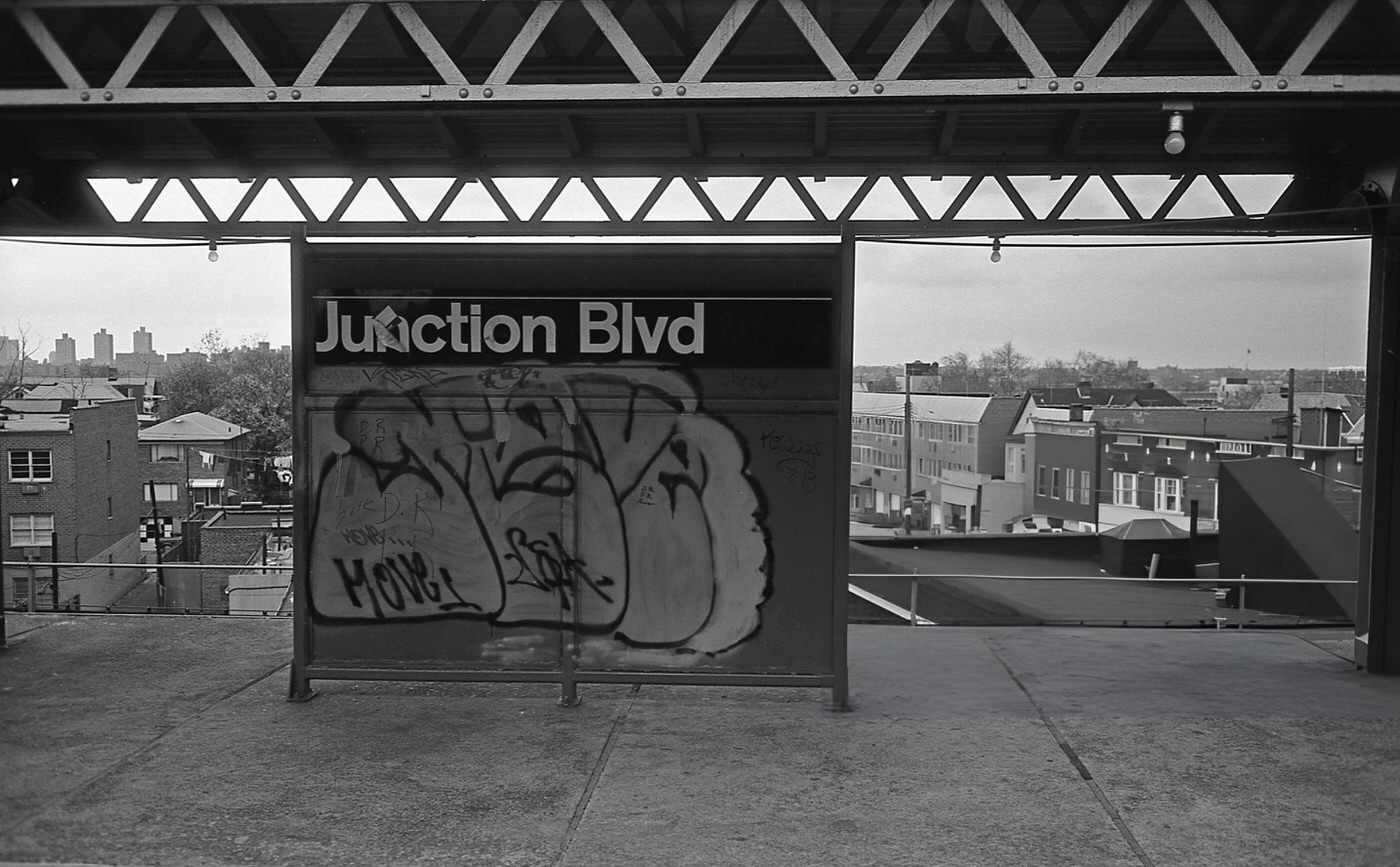 Graffiti Covers The Junction Boulevard Subway Sign On The Elevated Line In Corona, Queens, 1970S.