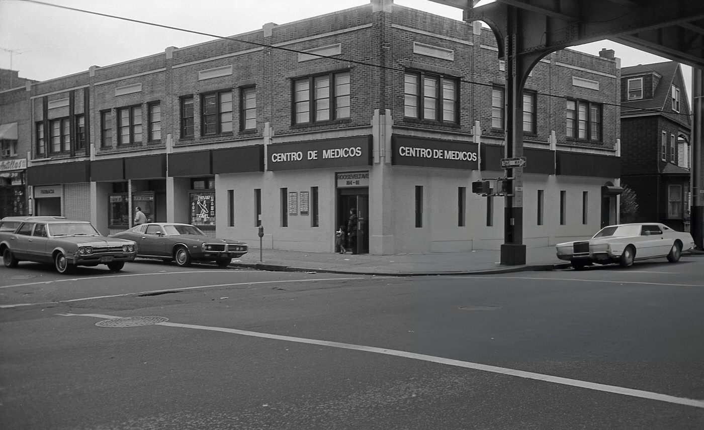 A Spanish Medical Center And Other Small Businesses Along Roosevelt Avenue In Corona, Queens, 1970S.