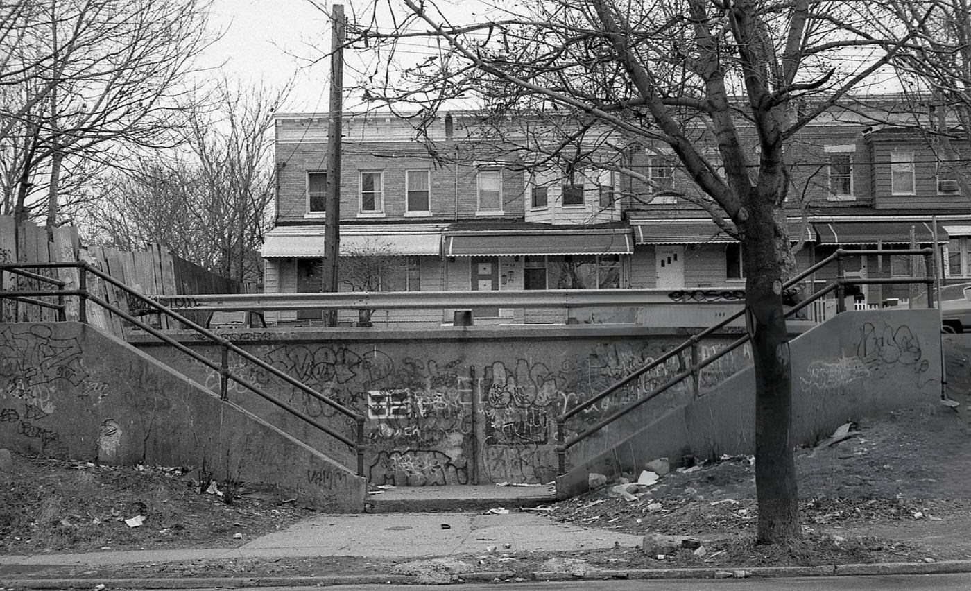 Dilapidated And Graffiti-Covered Cement Staircases Lead To Residential Homes On 37Th Avenue In Corona, Queens, 1982.