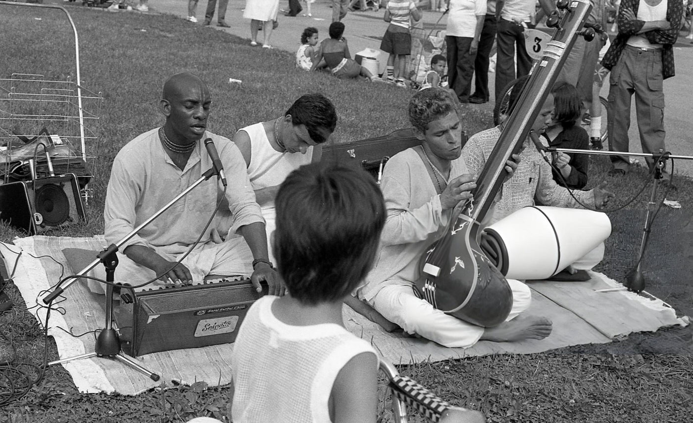 A Boy On A Bicycle Stops To Watch Musicians Perform Traditional Hindustani Music In Flushing Meadows Park, Corona, Queens, 1988.