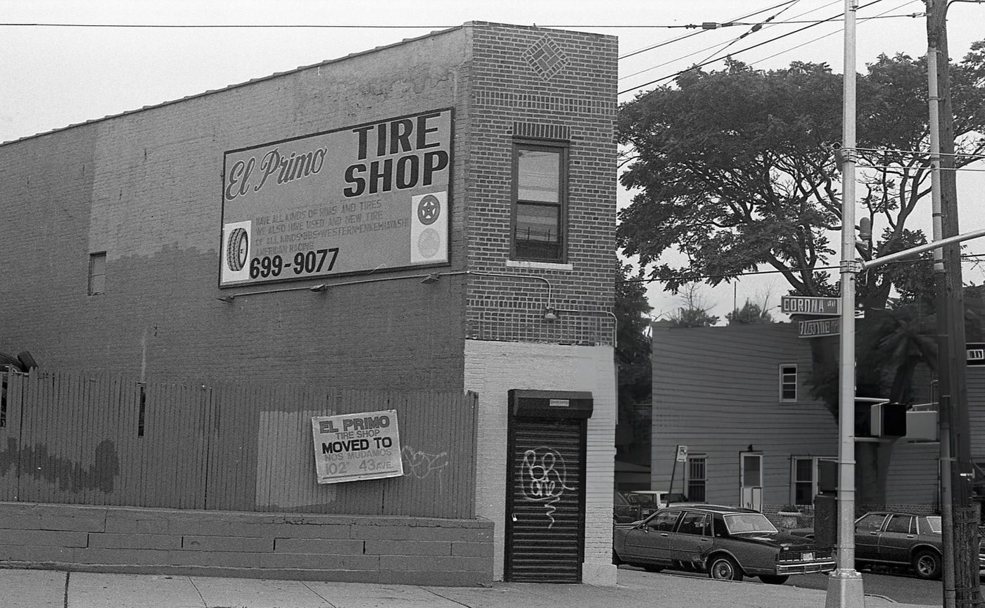 A Commercial Building At The Intersection Of Corona And Alstyne Avenues In Queens' Corona Neighborhood With A Billboard Advertising The El Primo Tire Shop, 1994.