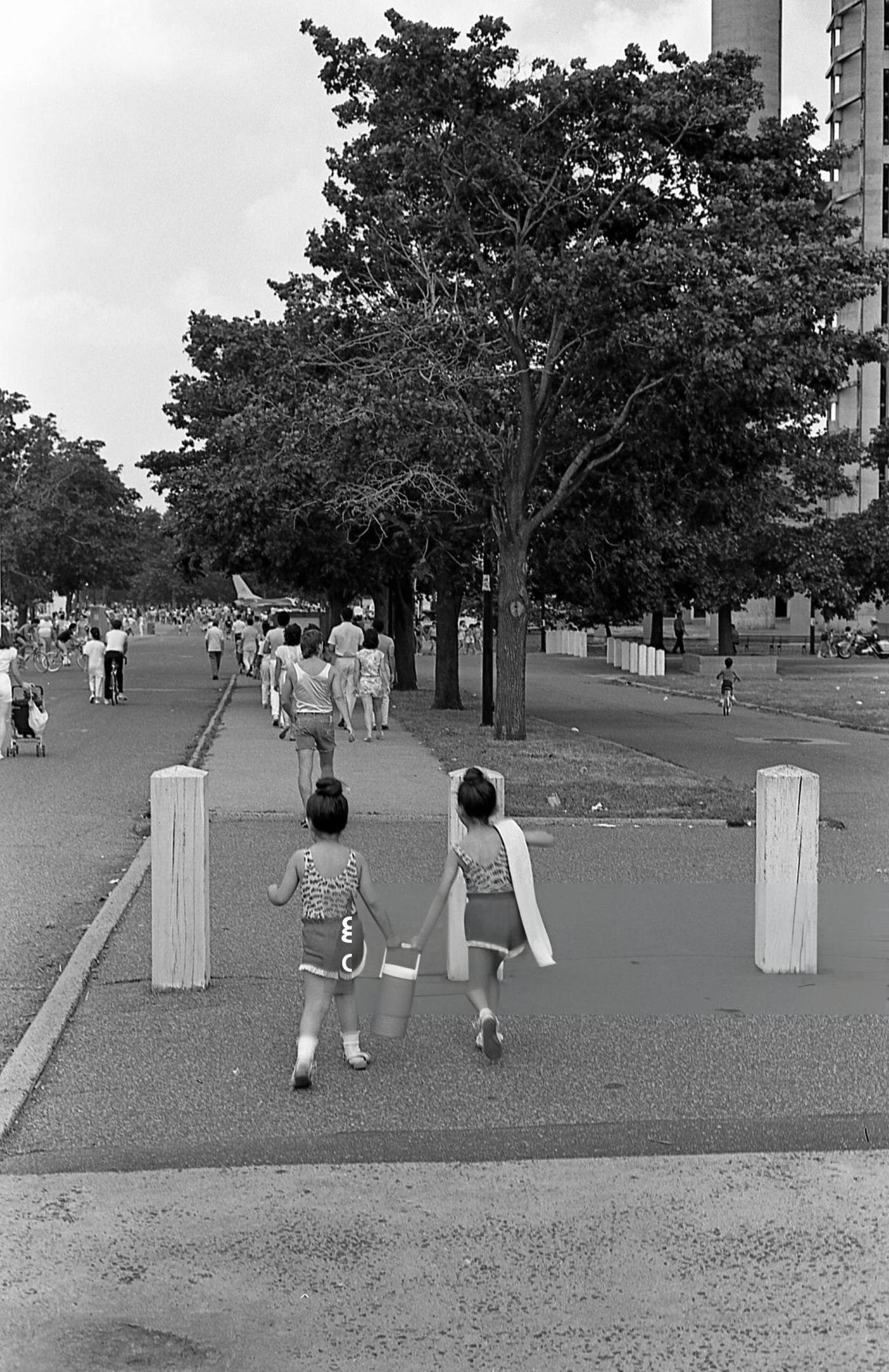 Two children enter Flushing Meadows Park in Corona, Queens, 1986.