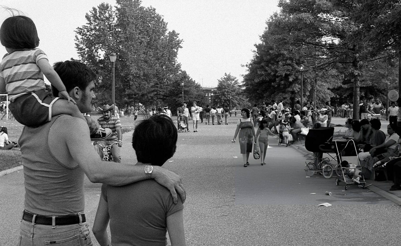 A man carries a child on his shoulders in Flushing Meadows Park, Corona, Queens, 1980.