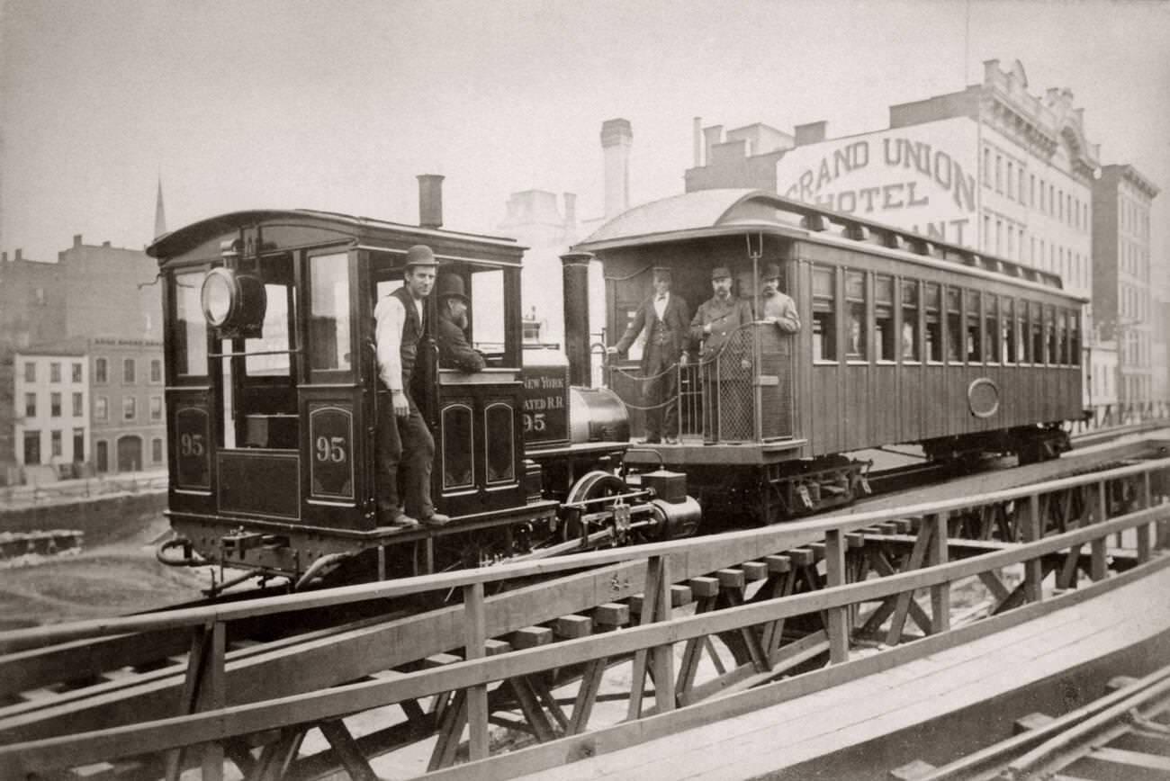 Locomotive &Amp;Amp; One Passenger Car Running On East 42Nd Street, Grand Union Hotel In Background, 1880