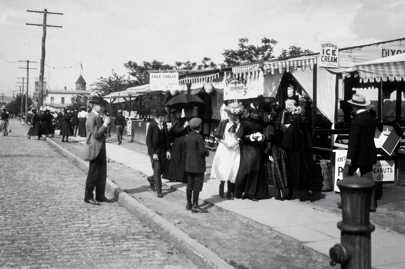People Line Up At A Frankfurter Stand At Audubon Avenue And 193Rd Street, With Fort George In The Background, Bronx, Circa 1898.