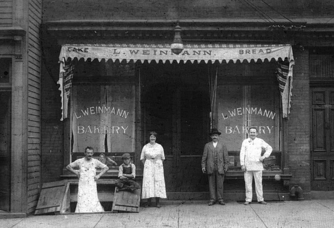 Staff Of Leonhard Weinmann'S Bakery In Baker'S Whites At 388 Van Duzer Street, Shop Opened 1918, Closed 1968; Later Home To Various Establishments Including Muddy Cup Coffee House, 1918