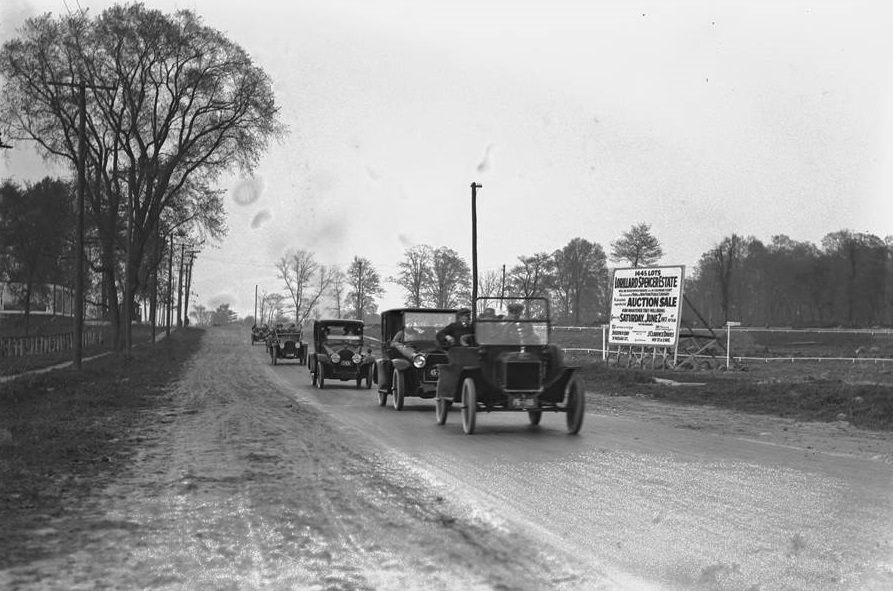 Automobiles Driving Past A Sign For The Lorillard Spencer Estate Sale, Bronx, Circa May-June 1917.