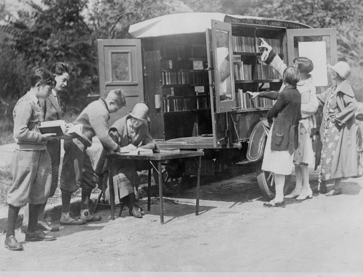 A Mobile New York Public Library Unit Parked On A Staten Island Street For Locals To Browse Books.