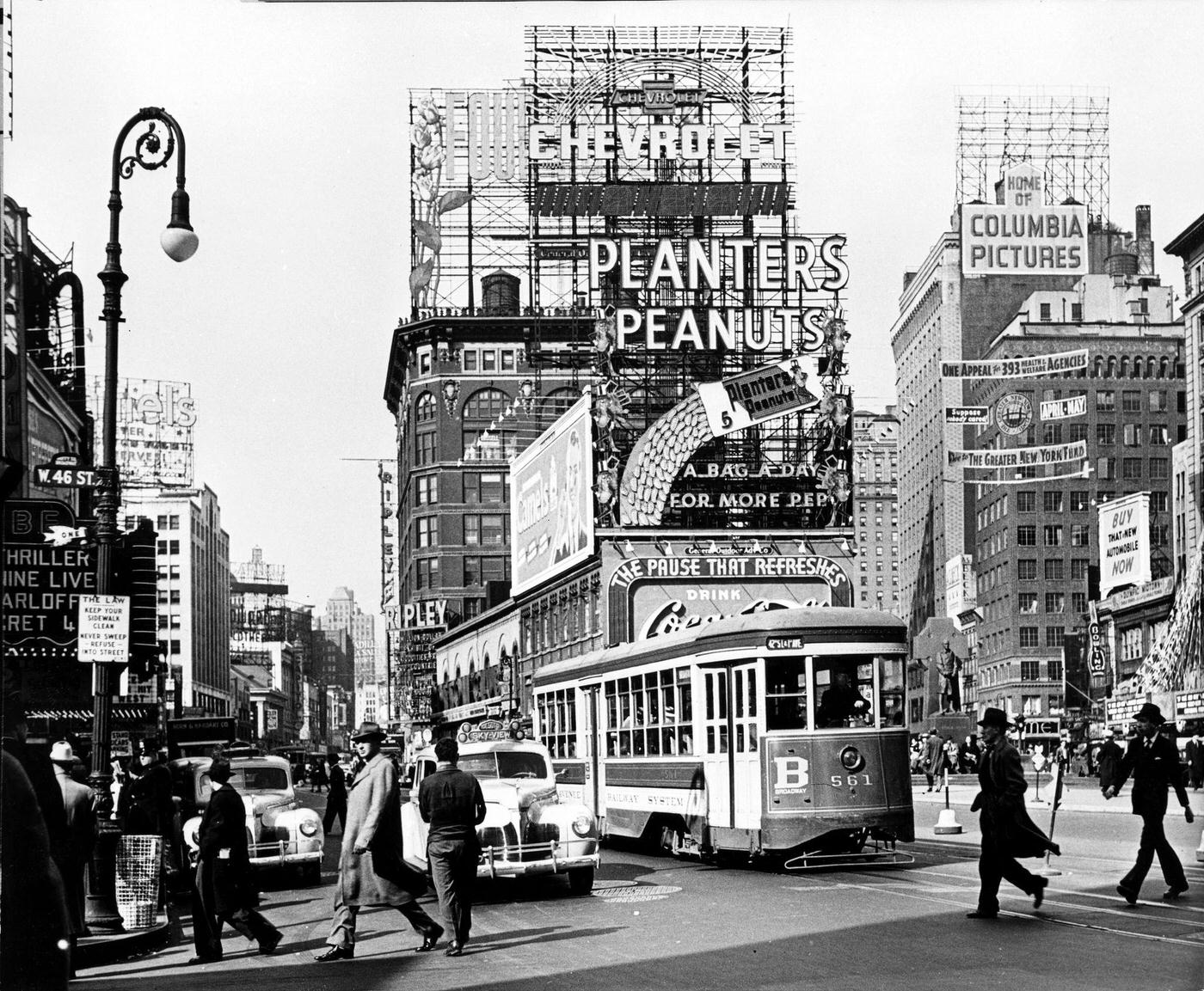 View Of Pedestrian And Street Traffic In Times Square, Manhattan, Spring 1940.