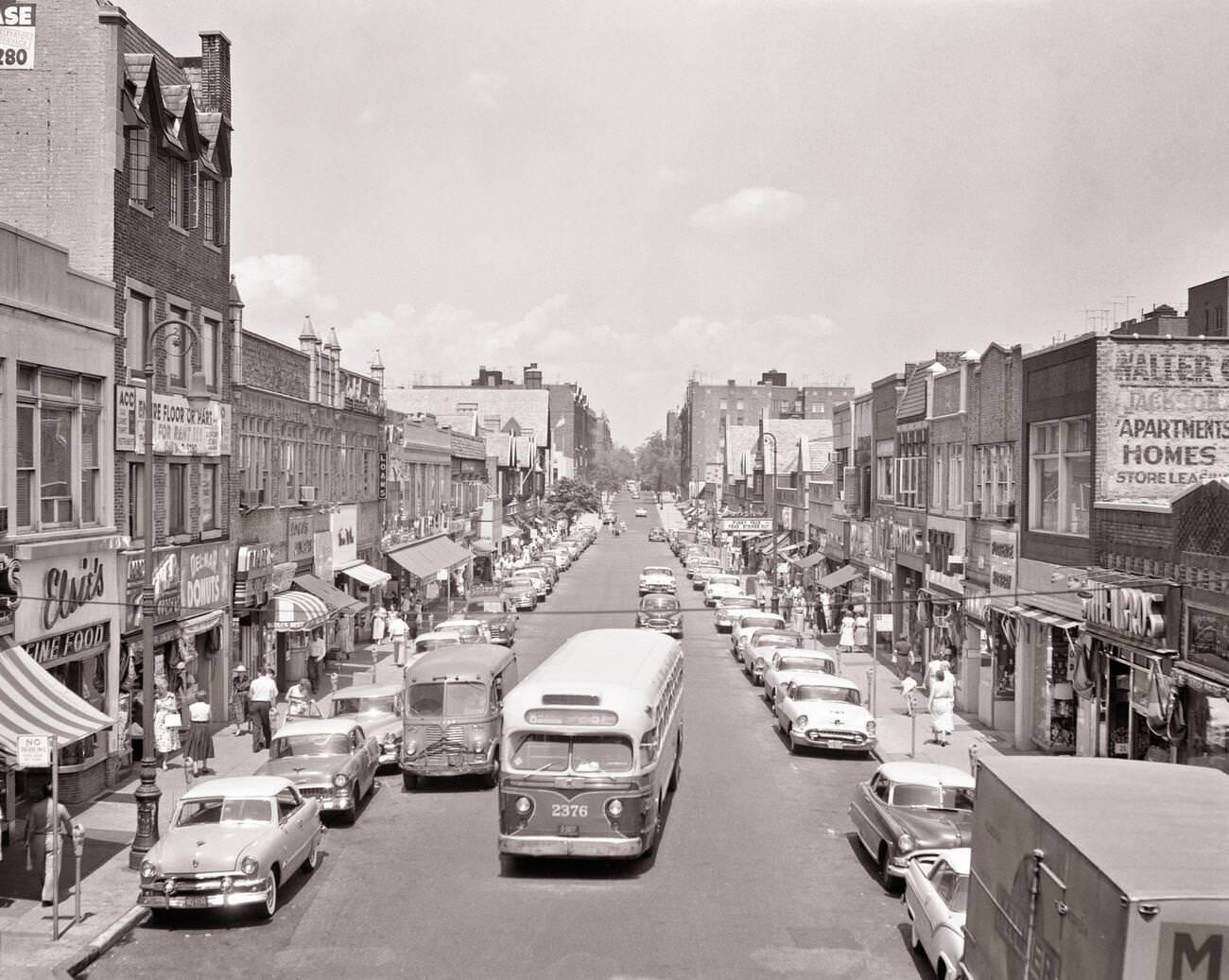 Pedestrians, Cars, Buses, And Delivery Trucks In The 82Nd Street Shopping District, Jackson Heights, Queens, 1957.