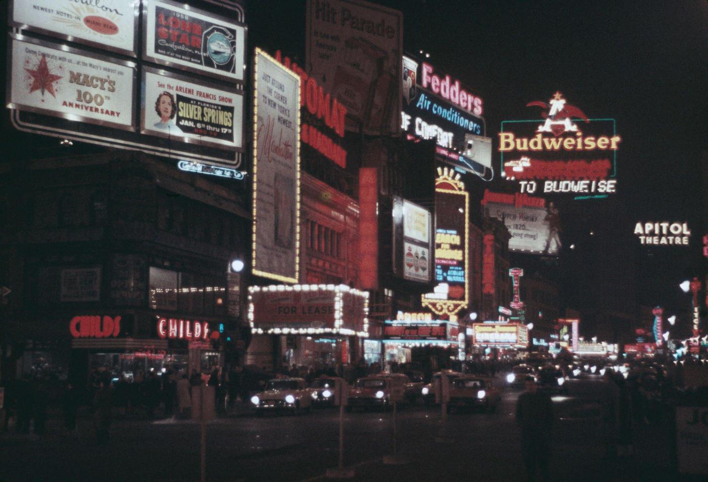 Various Advertisements Illuminated At Night In Times Square, Manhattan, 1957.
