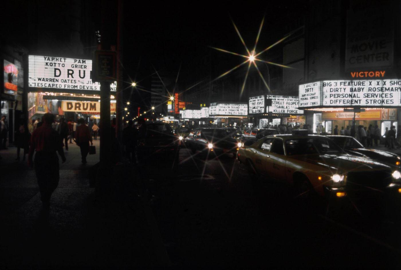 View Of The Marquees Of Cinemas On West 42Nd Street Including The Victory Theatre, The Lyric Theatre, The Times Square Theater And The Apollo Theatre In Manhattan, 1976.