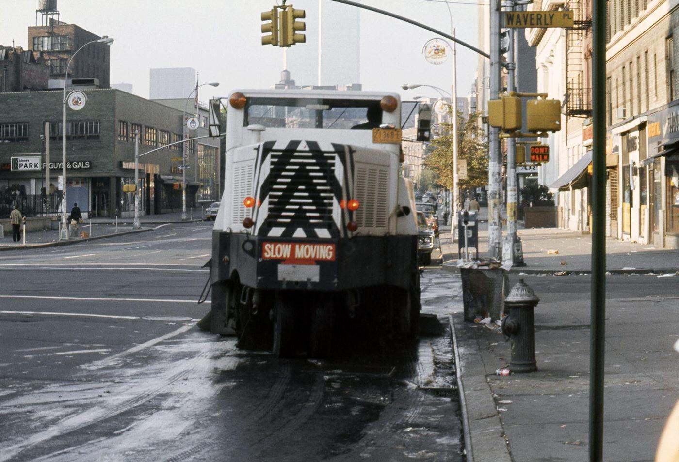 Street Sweeper At Intersection Of 6Th Avenue Waverly Place, Greenwich Village, Twin Towers In Background, Manhattan, 1976