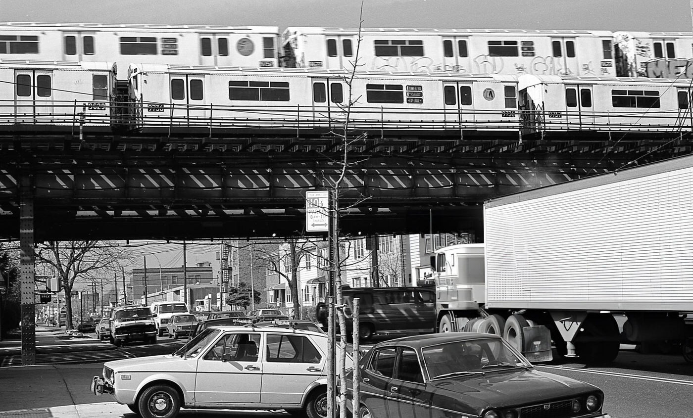 Street Traffic Under The Elevated Subway Tracks At The Intersection Of 108Th Street And Roosevelt Avenue In Corona, Queens, 1984.