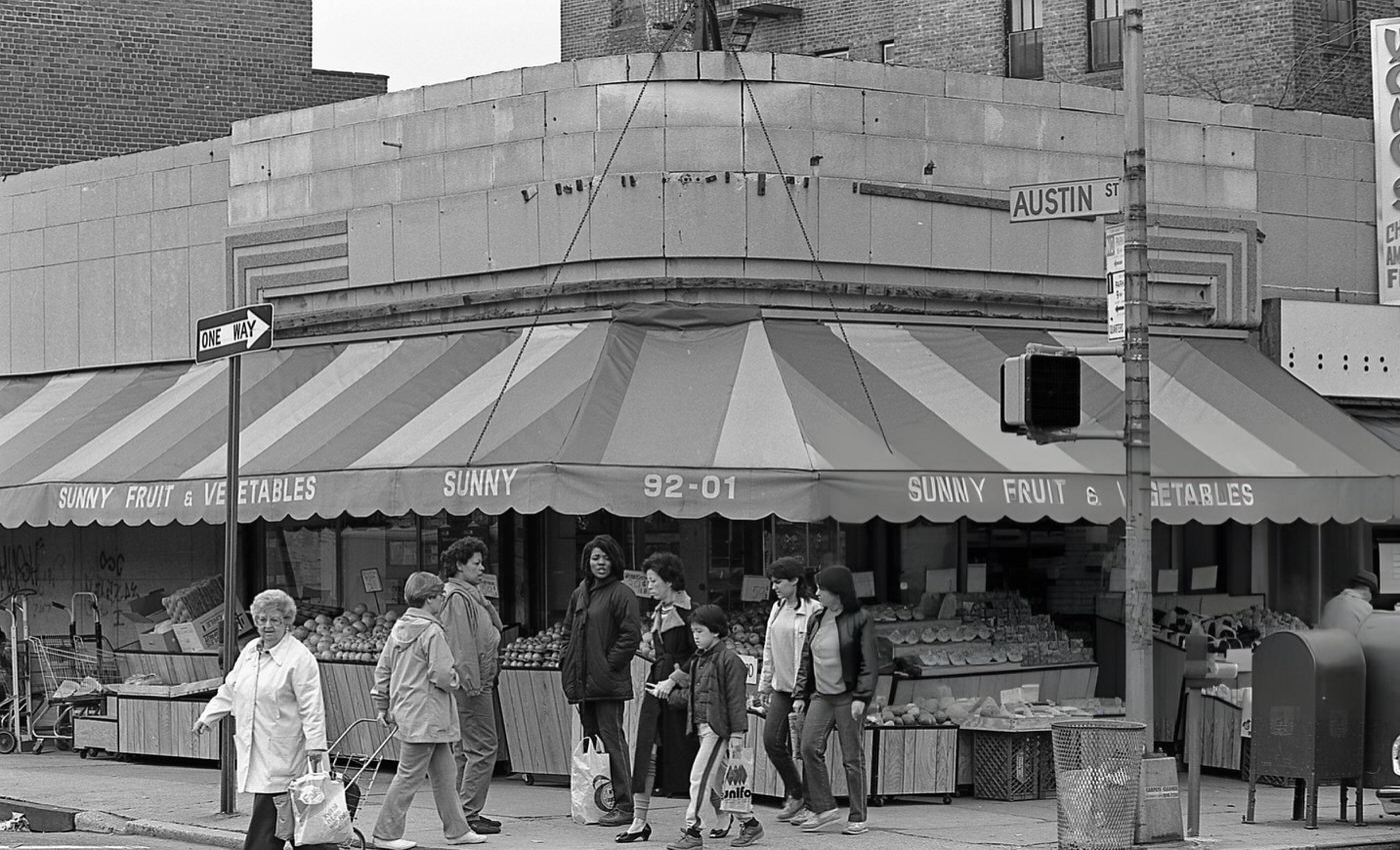 Pedestrians In Front Of The Sunny Fruit &Amp;Amp; Vegetables Market At The Intersection Of 63Rd Drive And Austin Street, Rego Park, Queens, 1984.