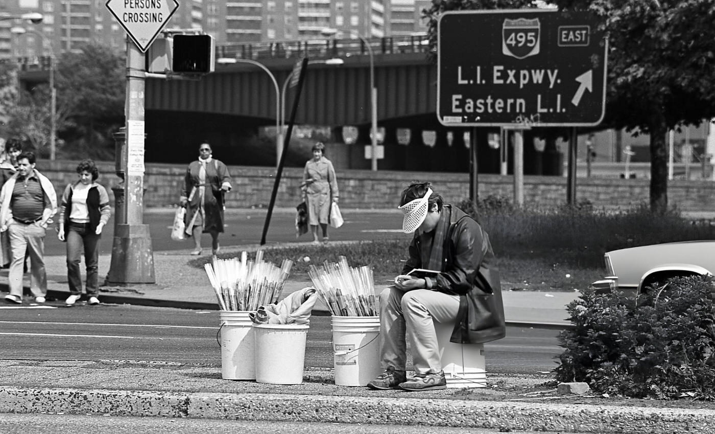 A Street Vendor Waits To Sell Flowers From Buckets On The Queens Boulevard Median, Elmhurst, Queens, 1984.