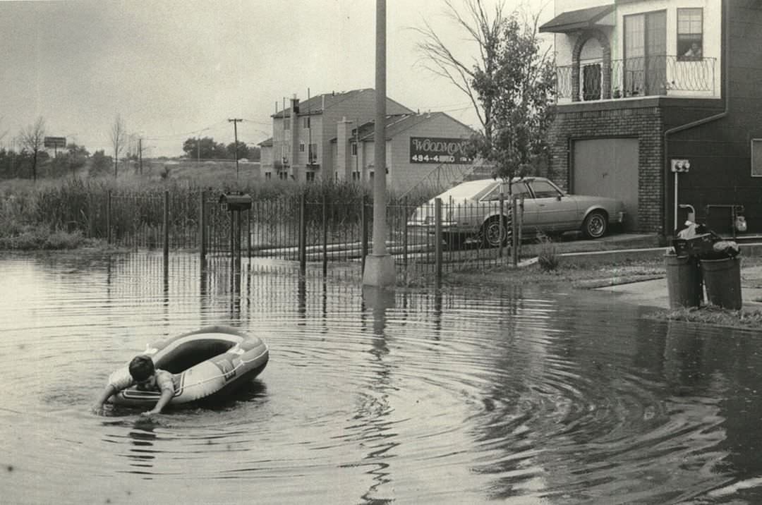 A Youngster Uses Raft In Front Of His Home On Gauldy Avenue, 1984
