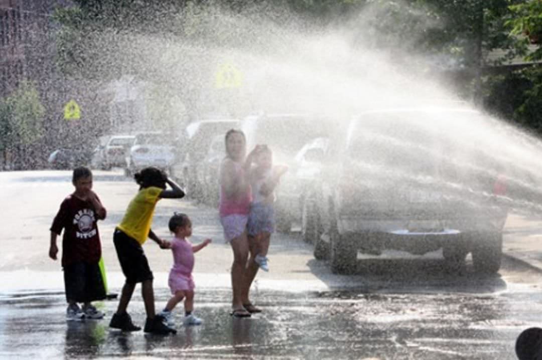 Children Cool Off In The Spray Of A Fire Hydrant On Broad Street, Stapleton, June 2008.