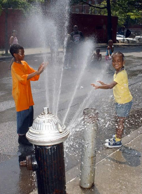 Stephen Jackson, 10, And Sister Celina, 6, Cool Off With Fire Hydrant Spray In Clifton, 2006.