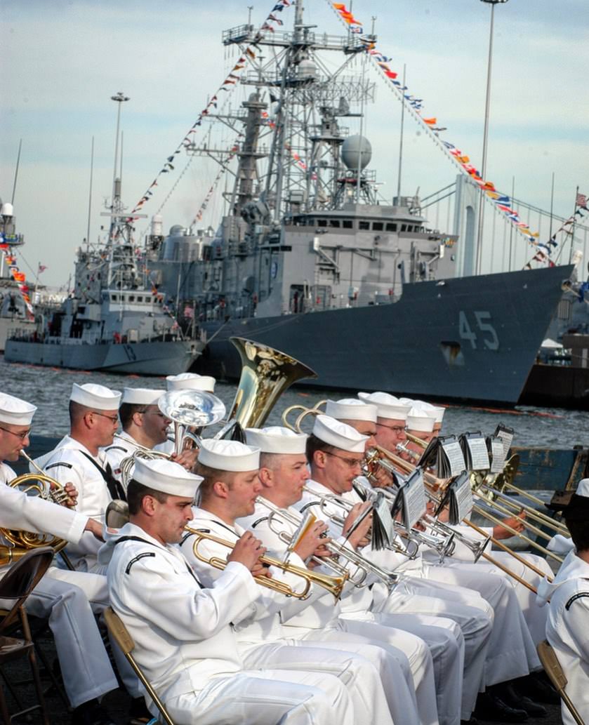 With One Of The Navy Ships As A Backdrop, The Navy Regions Northeast Band Performs At The Former Stapleton Navy Home Port, 2004.