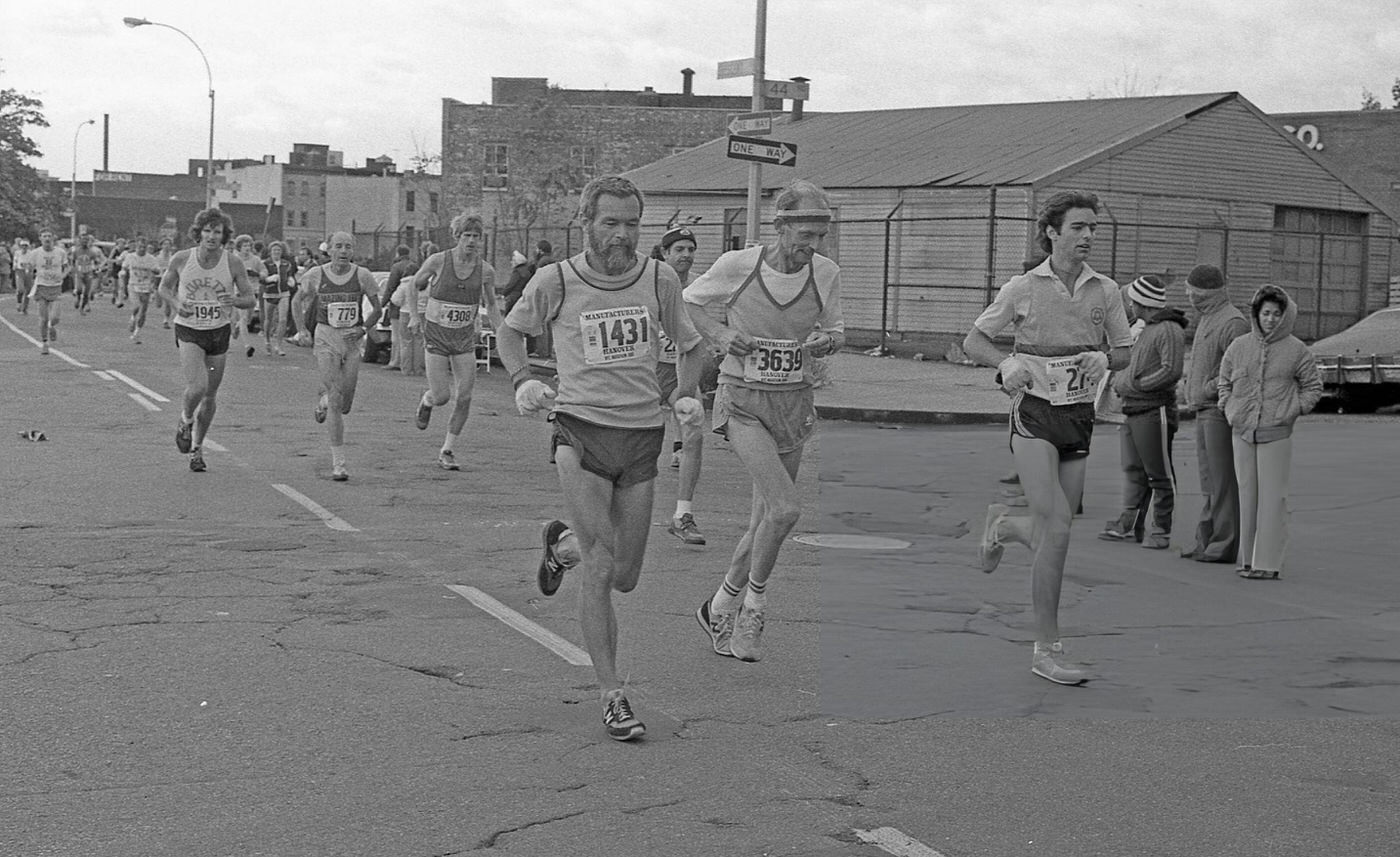 A group of runners pass the 14-mile marker on Crescent Street during the New York City Marathon, Queens, 1980.