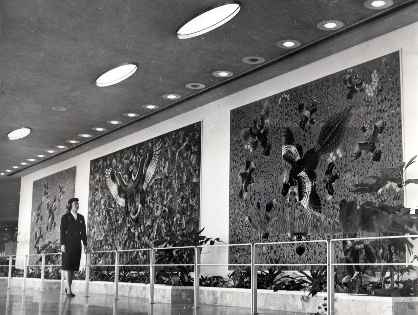 Daphne Thomas, Customer Service Representative For Air France, Looks At Tapestries By Rene Perrot At Idlewild Airport, 1960.