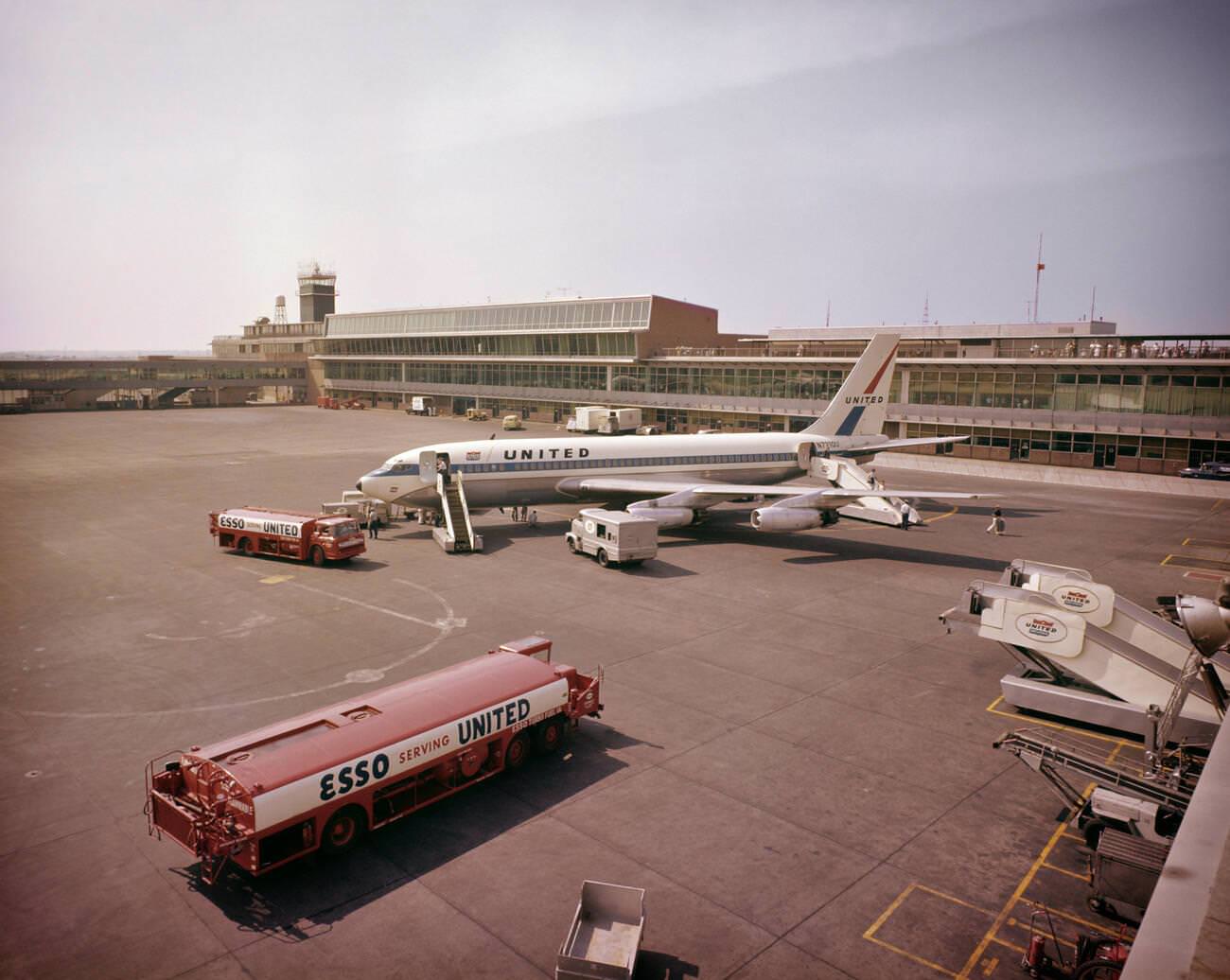 A United Boeing 720 Commercial Jet Airplane Debarking Passengers At New York International, Now Jfk Airport, Queens, 1960S.