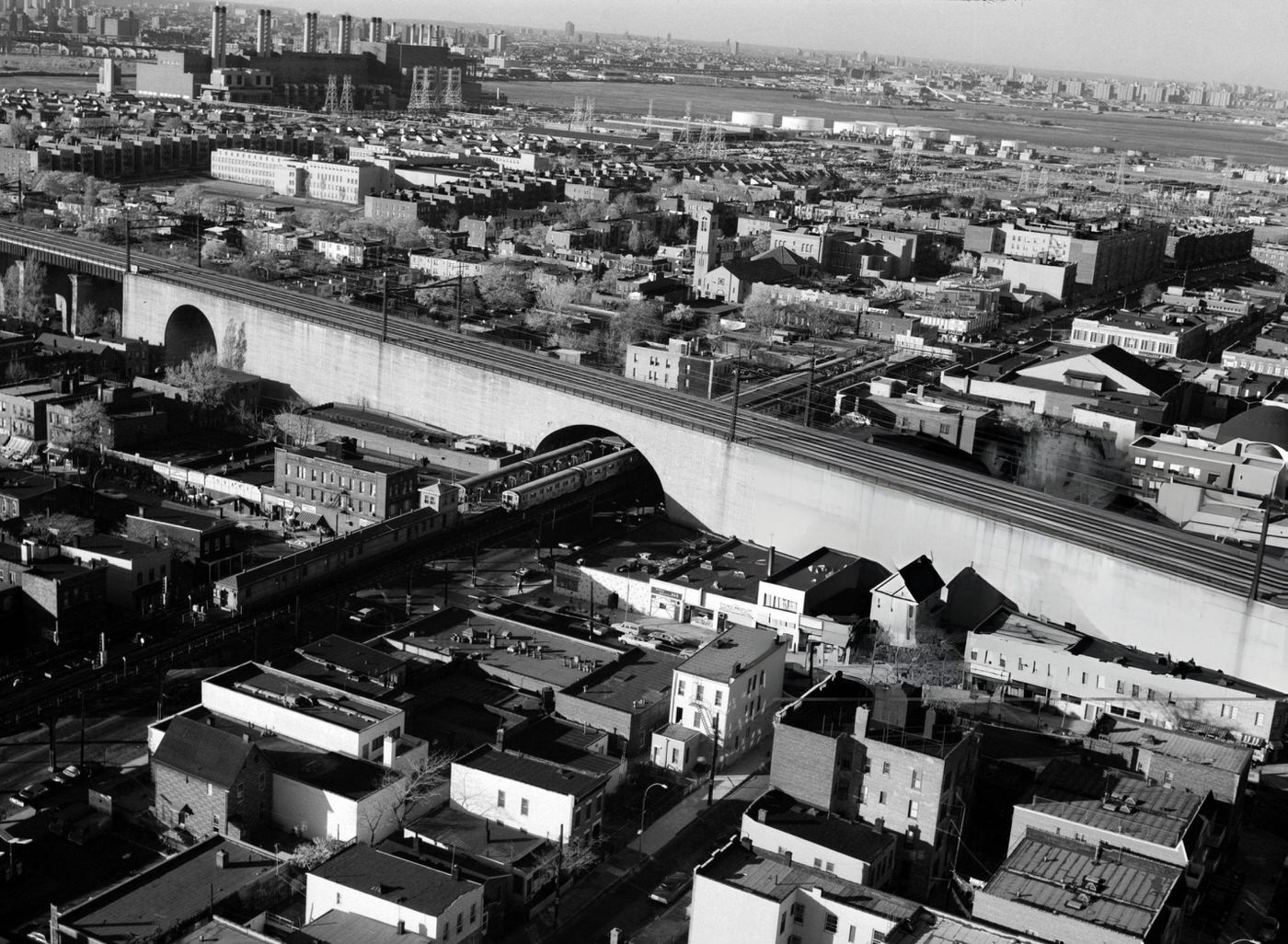 A Subway Train Travels Under The Railroad Viaduct That Crosses 31St Street In Queens, 1970S.