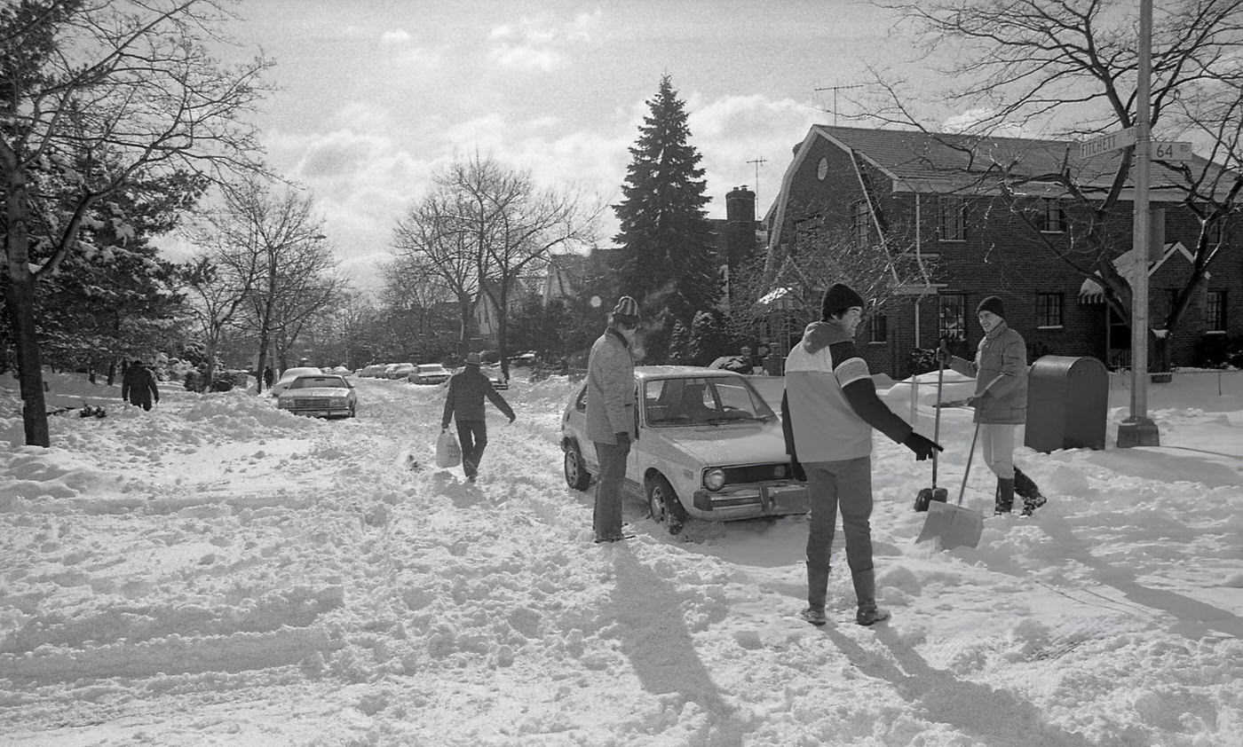A Group Of Good Samaritans Help Dig Out A Vehicle Stranded In Deep Snow In The Aftermath Of The Blizzard Of 1978.