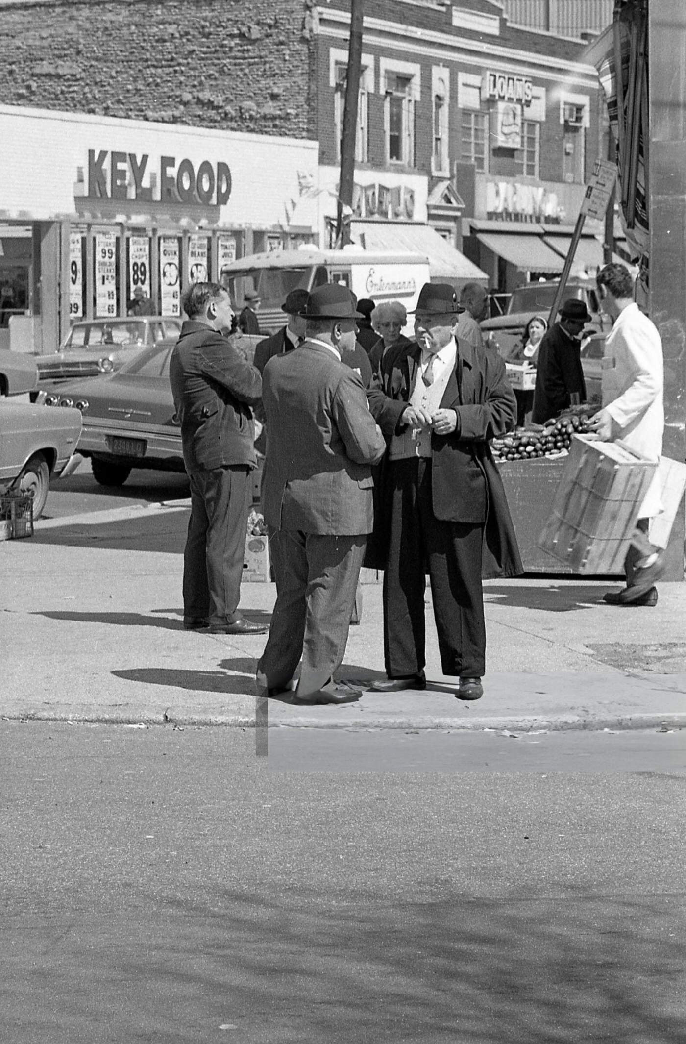 Two Men Talking At The Corner Of National Street And 41St Avenue In Corona, Queens, 1970.