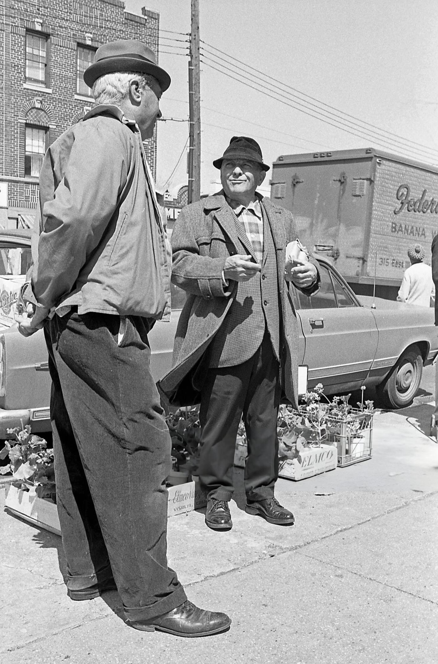Two Men Talking On National Street In Corona, Queens, 1970.