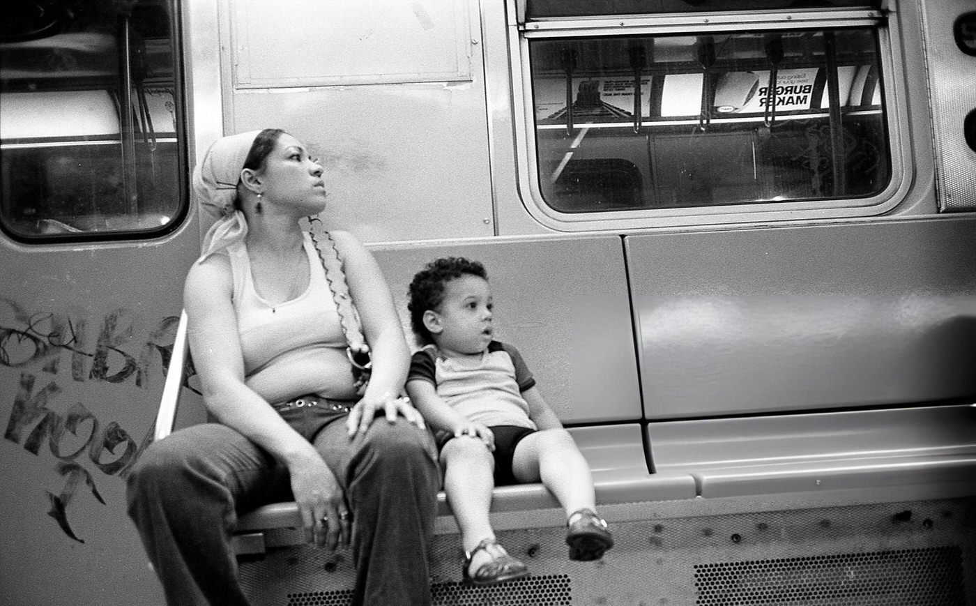 A Woman And A Young Child Ride A Subway Train, Queens, 1970S.