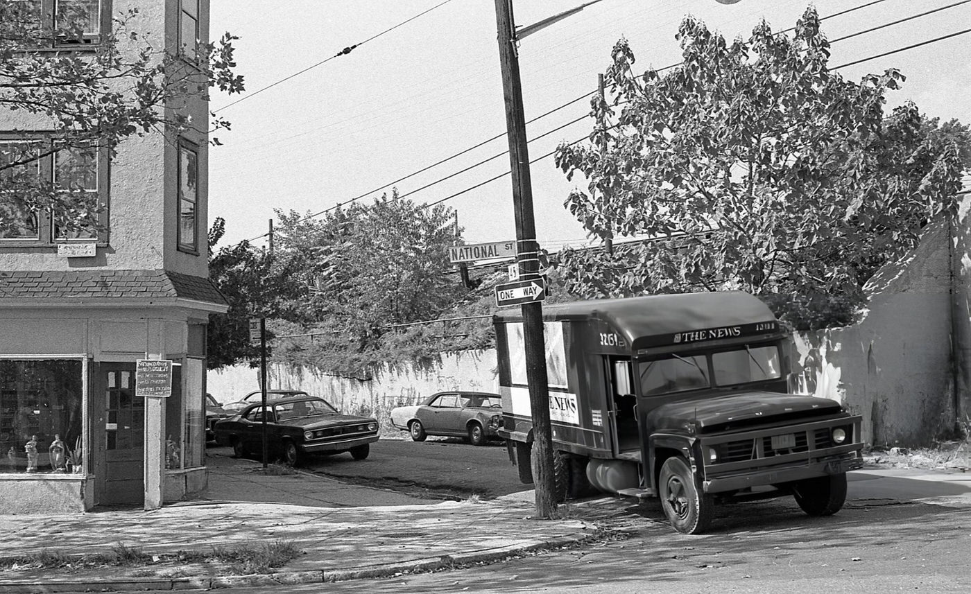 'The News' Delivery Truck Parked At The Corner Of National Street In Queens' Corona Neighborhood, 1970S.