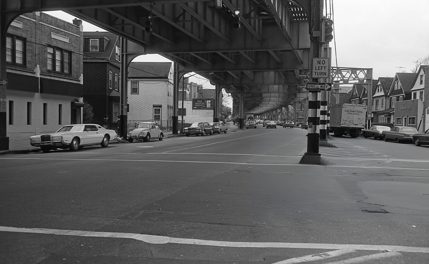 A Street-Level View Under The Elevated Subway Line Along Roosevelt Avenue In Corona, Queens, 1974.